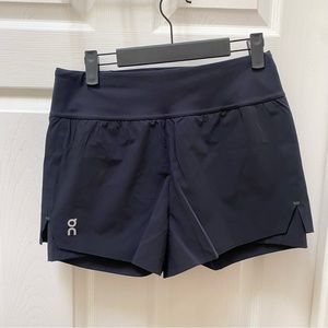 On Running black shorts built in spandex running athletic